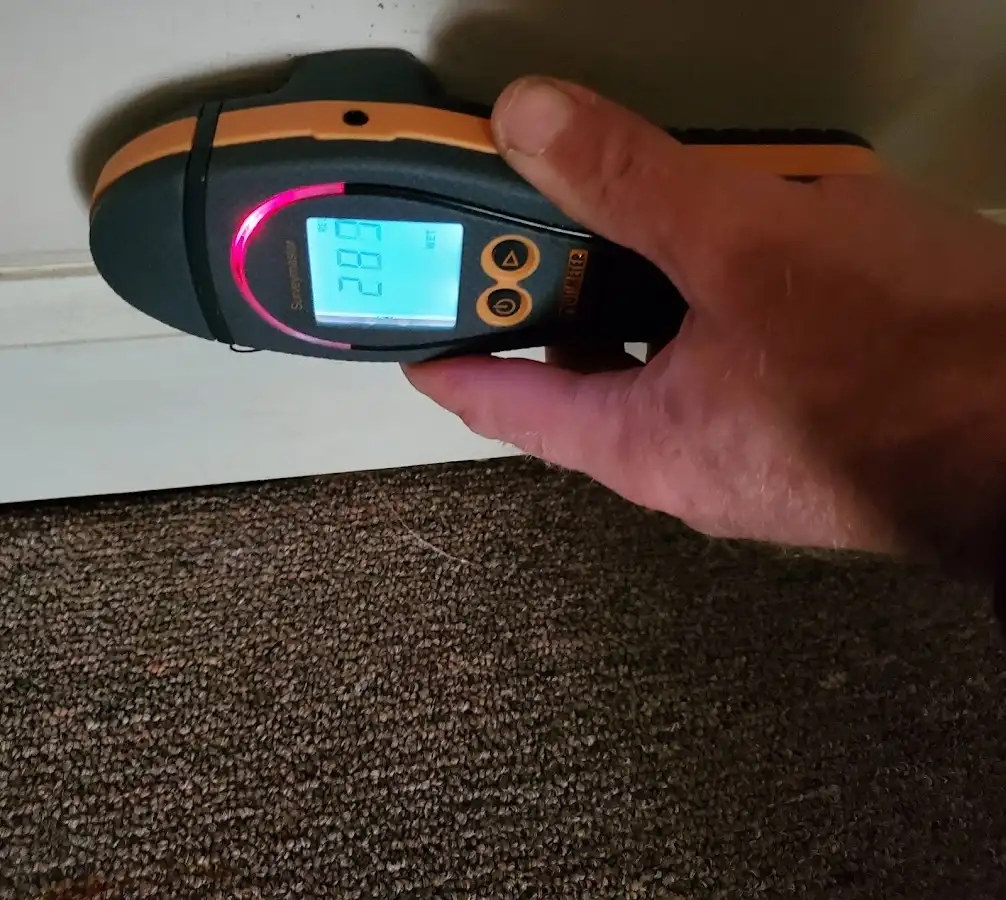 Moisture detection at baseboard during Storm Damage Restoration in Uxbridge